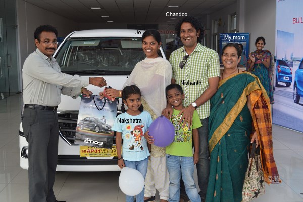 Jo my wife taking delivery of our new car - Toyota Innova. You can see my mom & kids too in the picture.